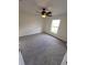 Comfortable bedroom with a ceiling fan and natural light from the window at 1402 Jakway Rd, North Port, FL 34288