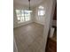 Cozy dining area illuminated with stylish light fixtures and view to the exterior at 1402 Jakway Rd, North Port, FL 34288