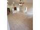 Open living space featuring tile floors, vaulted ceilings, and natural lighting at 1402 Jakway Rd, North Port, FL 34288