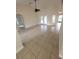 Bright living room boasts tile flooring, and access to the outdoor patio at 1402 Jakway Rd, North Port, FL 34288