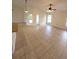 Bright living area with tiled floors, vaulted ceiling, and multiple windows at 1402 Jakway Rd, North Port, FL 34288