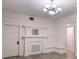 Elegant living room featuring a decorative fireplace, chandelier and beautiful natural lighting at 1404 W Granfield Ave, Plant City, FL 33563