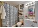 This bathroom has a shower with a curtain, vanity, and toilet at 1410 24Th E Ave, Bradenton, FL 34208