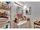 Bathroom features a vanity with a mirror, a shelf unit, and ample counter space at 1410 24Th E Ave, Bradenton, FL 34208