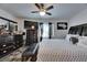 Bedroom featuring a large dresser, flat screen television and bench seat at 1410 24Th E Ave, Bradenton, FL 34208