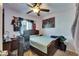 Bedroom with bed, ceiling fan, and desk at 1410 24Th E Ave, Bradenton, FL 34208