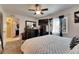 This bedroom has neutral carpet, a dresser, and a large window at 1410 24Th E Ave, Bradenton, FL 34208