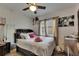 Bedroom with ceiling fan, mirror and decor at 1410 24Th E Ave, Bradenton, FL 34208