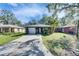 Charming single-story home with a well-manicured lawn and an attached single-car garage at 1410 24Th E Ave, Bradenton, FL 34208