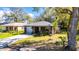 Charming single-story home with a well-maintained front yard and inviting curb appeal at 1410 24Th E Ave, Bradenton, FL 34208