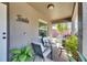 Inviting front porch with comfortable seating and decorative plants, perfect for relaxing outdoors at 1410 24Th E Ave, Bradenton, FL 34208