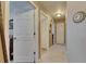 Hallway with tile flooring and access to closets and other rooms at 1410 24Th E Ave, Bradenton, FL 34208