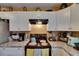 Close up on stove area, white cabinets, and granite countertops at 1410 24Th E Ave, Bradenton, FL 34208