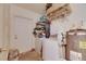Functional laundry room with white appliances and ample space for storage, including a hot water heater at 1410 24Th E Ave, Bradenton, FL 34208