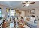 Comfortable living room with large windows and stylish decor, creating a warm and inviting atmosphere at 1410 24Th E Ave, Bradenton, FL 34208