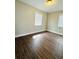 Bedroom with luxury vinyl plank flooring and light-filled windows at 1421 8Th E Ave, Bradenton, FL 34208