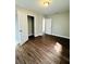 Large bedroom with wood look floors and two closets at 1421 8Th E Ave, Bradenton, FL 34208