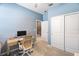 Comfortable bedroom with a desk, closet, and a bright workspace, ideal for work or study at 14355 59Th E Cir, Bradenton, FL 34211