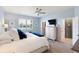 Cozy bedroom featuring a plush bed, large window, dresser, and a ceiling fan at 14355 59Th E Cir, Bradenton, FL 34211