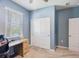 Bright bedroom featuring a desk, closet, and a window, creating a cozy and functional space at 14355 59Th E Cir, Bradenton, FL 34211