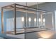 Modern chandelier with six lights and a unique rectangular frame, adding elegance to any room at 14355 59Th E Cir, Bradenton, FL 34211