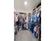 Spacious walk-in closet with ample shelving, rods, and organized storage for clothing and shoes at 14355 59Th E Cir, Bradenton, FL 34211