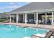 Resort-style community pool with covered lounge area, providing residents with a luxurious retreat at 14355 59Th E Cir, Bradenton, FL 34211