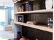 Stylishly decorated built-in shelving, complete with nautical-themed decor and decorative items at 14355 59Th E Cir, Bradenton, FL 34211