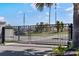 Secured black metal community entrance gates offering residents privacy and neighborhood protection at 14355 59Th E Cir, Bradenton, FL 34211