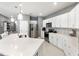 Bright, modern kitchen with island, stainless steel appliances, and white cabinetry at 14355 59Th E Cir, Bradenton, FL 34211