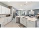 Spacious kitchen with an island, stainless steel dishwasher, and open layout to the living room at 14355 59Th E Cir, Bradenton, FL 34211