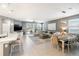 Bright and airy living room showcasing an open layout with a dining area and sliding doors to an outdoor patio at 14355 59Th E Cir, Bradenton, FL 34211