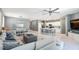 Bright open floor plan seamlessly connects the living area, dining space, and kitchen with modern finishes at 14355 59Th E Cir, Bradenton, FL 34211