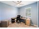 Bright home office with a modern desk setup, comfortable chair, and ample natural light from the window at 14355 59Th E Cir, Bradenton, FL 34211