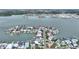 Aerial view of waterfront community, showcasing the surrounding water and neighborhood at 16103 6Th E St, Redington Beach, FL 33708