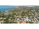 Aerial view of homes in neighborhood with tree lined street at 1622 Wisconsin Ln, Sarasota, FL 34239