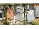 Birds-eye view of home featuring charming roof and lush landscaping at 1622 Wisconsin Ln, Sarasota, FL 34239