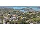 Aerial view of the community with lush greenery, coastal waters, and surrounding neighborhood at 1622 Wisconsin Ln, Sarasota, FL 34239