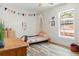 Bedroom featuring decorative accents, wood flooring, and natural light at 1622 Wisconsin Ln, Sarasota, FL 34239