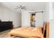 Comfortable bedroom with a sliding barn door to the bathroom and a black dresser at 1622 Wisconsin Ln, Sarasota, FL 34239