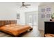 Bright bedroom with natural light, wooden bed frame, and sliding glass doors to the outdoors at 1622 Wisconsin Ln, Sarasota, FL 34239