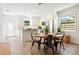 Bright dining area next to the kitchen, featuring a modern dining table and easy access to the kitchen at 1622 Wisconsin Ln, Sarasota, FL 34239