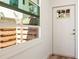 Bright entryway with a charming front door featuring glass panes and lots of natural light at 1622 Wisconsin Ln, Sarasota, FL 34239