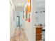 Hallway with wood flooring and colorful decor at 1622 Wisconsin Ln, Sarasota, FL 34239