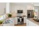 Renovated kitchen with white cabinets, stainless steel appliances, and decorative pendant lighting at 1622 Wisconsin Ln, Sarasota, FL 34239
