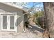 Side yard with gravel hardscape, wood fence, and planting area with low maintenance landscaping at 1622 Wisconsin Ln, Sarasota, FL 34239