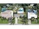 Aerial view of houses with private pools along a canal with boat docks at 1633 Ridgewood Ln, Sarasota, FL 34231