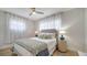 Calm bedroom with soft, natural light, features a plush bed, tasteful decor, and hardwood floors for a comfortable retreat at 1633 Ridgewood Ln, Sarasota, FL 34231
