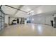 Spacious and clean garage with ample storage space, shelving, and room for multiple vehicles and equipment at 1633 Ridgewood Ln, Sarasota, FL 34231