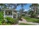 Charming gazebo in a lush garden setting, perfect for relaxation, overlooking the serene waterway at 1633 Ridgewood Ln, Sarasota, FL 34231